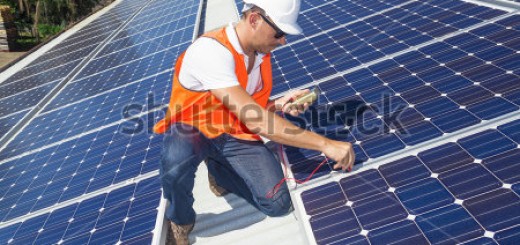 worker installing solar panels